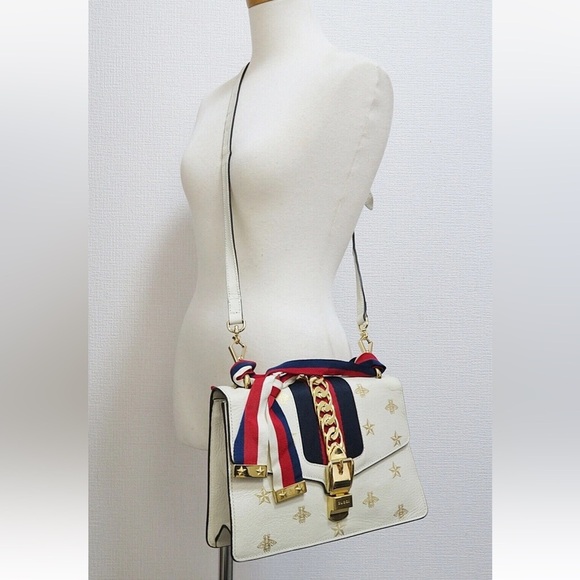 Gucci Ivory Crossbody Bag with Gold and Navy Accents - Picture 1 of 15